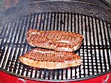 Top sirloin grilling over mesquite