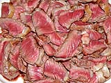 Slices of top sirloin cooked medium rare