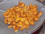 Oil-roasted cashews cooling and hardening