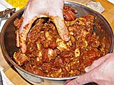 Coating soy-marinated pork with curry paste