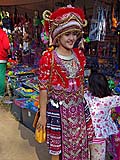 Young girl in festive hat, Hmong New Year 2013 at Mae Sa Mai