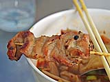 Grilled pork-on-a-stick at Aw Taw Kaw market, Bangkok