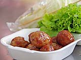 Sour sausage balls and accompanying veggies at Aw Taw Kaw market, Bangkok