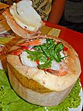 Mixed seafood curry in a young coconut at Toh Plue in Chatuchak Market