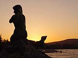 Mermaid in silhouette at sunset on Samila Beach, Songkhla