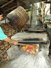 Boiling down coconut nectar, side canal near Damnoen Saduak floating market