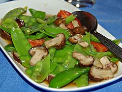 Snow peas and mushrooms at Kai Mook