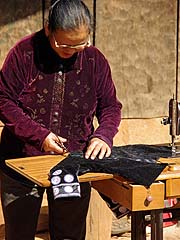 Woman sewing Mae Sa Mai