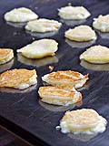 Coconut Pancakes on the Griddle at Damoen Saduak Floating Market