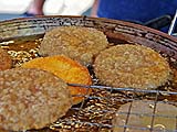 Frying and cooling glutinous rice doughnuts, Nakhon Pathom street market