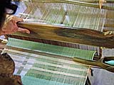 Weaver working the loom, Pa-Da Cotton Textile Museum