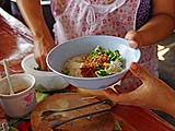 Adding seasonings to noodles, Sukhothai-style Noodle Shop