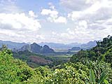 Foliage-covered limestone karsts, along the road to Khao Sok park