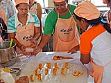 Making rolled cakes for sale on Koh Yoh, Songkhla